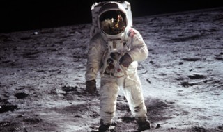 Astronaut Buzz Aldrin walks on the surface of the Moon.