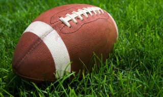 Close-up of a football in the grass.