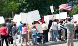 A group of peaceful protesters with banners and posters