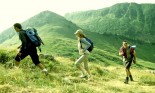 Men and women hiking in mountains