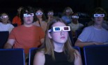 Teenagers watching a movie with 3-D glasses