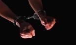 Woman's hands in handcuffs