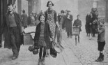 People walking street after German raid, World War II, Liverpool, England