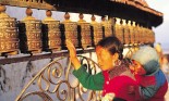 Woman holding child at a stupa, Kathmandu