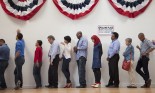 Voters waiting to vote in polling place