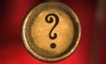 Old typewriter key with question mark