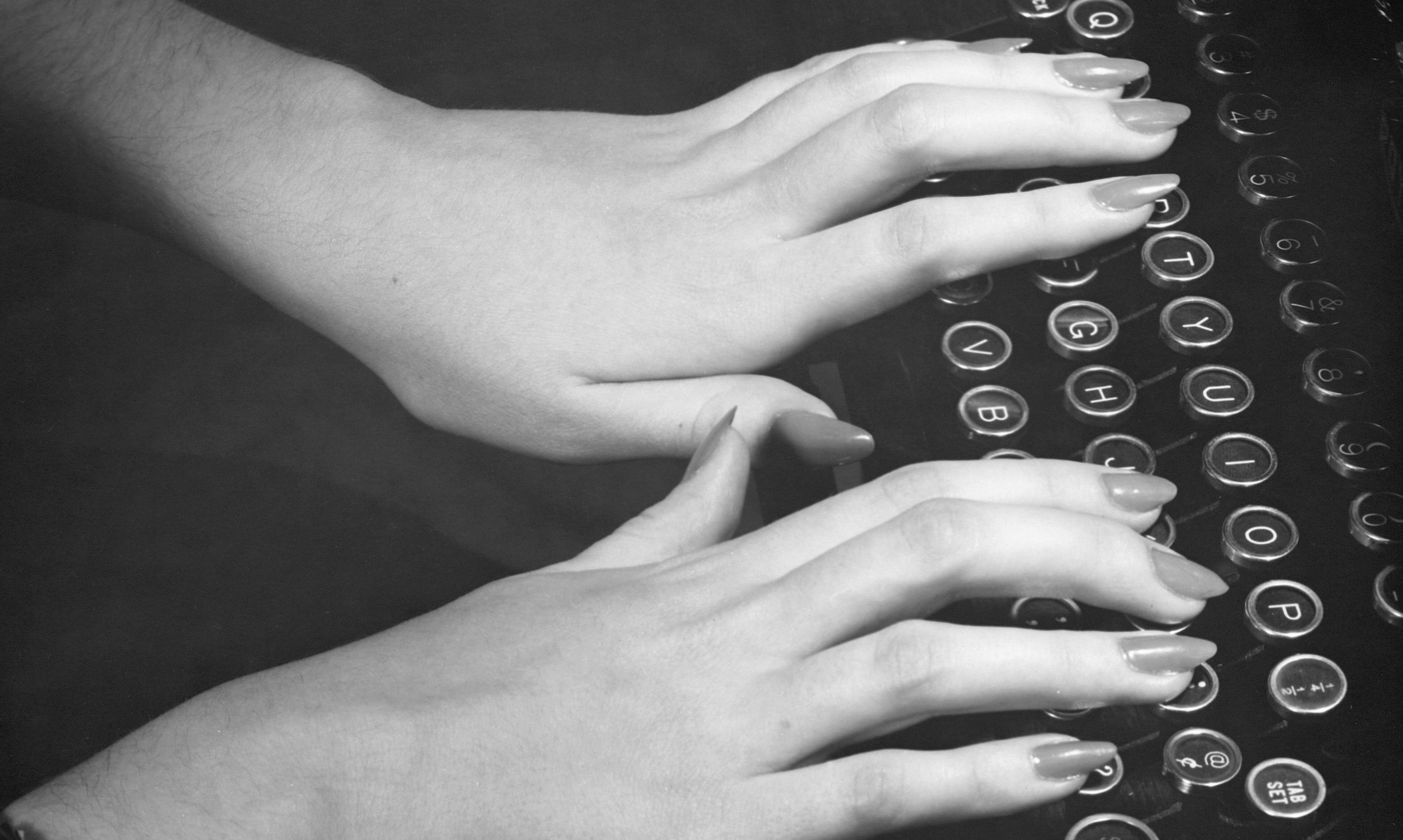 Woman's hands at typewriter