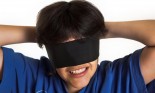 Boy with blindfolding scarf