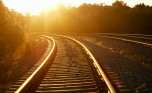 Curved railroad in sunset