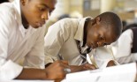 Portrait of two South African boys studying in rural classroom