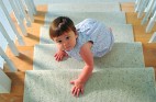 Baby crawling up stairs