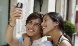 Couple taking their picture with a cell phone