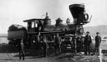 Railroad men in front of locomotive