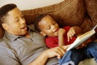 Father reading to son