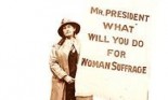 Suffragette at the White House with sign in 1916