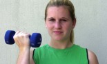 teen girl lifting weights