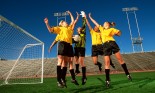 Soccer team high-fiving