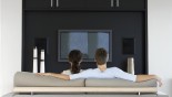Couple watching tv on couch