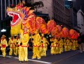 Children dancing with a dragon during Chinese New Year Parade