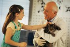 Girl and vet with cat