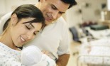 Mother and father with their newborn baby