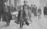 People walking street after German raid, World War II, Liverpool, England