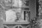 Portrait of Mark Twain looking out window
