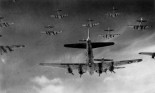 B-17 Flying Fortresses from the 398th Bombardment Group fly a bombing run to Neumunster, Germany, on 4/8/1945
