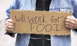 Person holding a Will Work for Food cardboard sign
