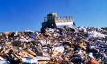 Bulldozer on top of landfill, USA