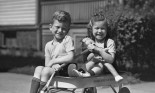 Young boy and girl in a wagon