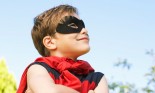 Boy (7-9 years old) wearing super hero costume