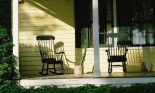 Front porch of house with rocking chairs