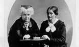 Susan B. Anthony and Elizabeth Cady Stanton sitting together at table.