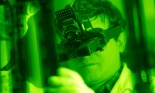 Technician Examining Film in Green Light