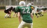 Back of a football player during a game