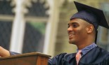 Side view of young man giving graduation speech