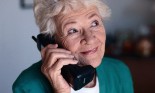 Elderly Woman Talking on Cordless Telephone