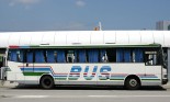 White bus with blue lettering/design