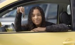 Teenage girl in new car