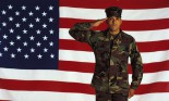 Marine saluting against American flag