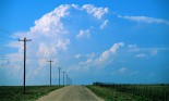 Puffy Clouds over Country Road