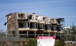 Building with wind damage and a "No Trespassing" sign, following Hurricane Katrina, Biloxi, MS