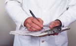 Doctor Writing on a Clipboard