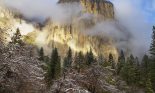 Yosemite National Park's El Capitan peeks through winter storm clouds during a December storm, Yosemite National Park, California, USA