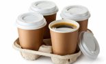 Four take-out coffee in holder. One cup is opened