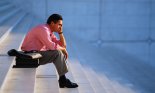 Dejected Businessman Sitting on Steps