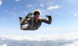 Close up of smiling man skydiving