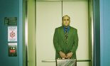 Nervous Businessman Standing in Elevator