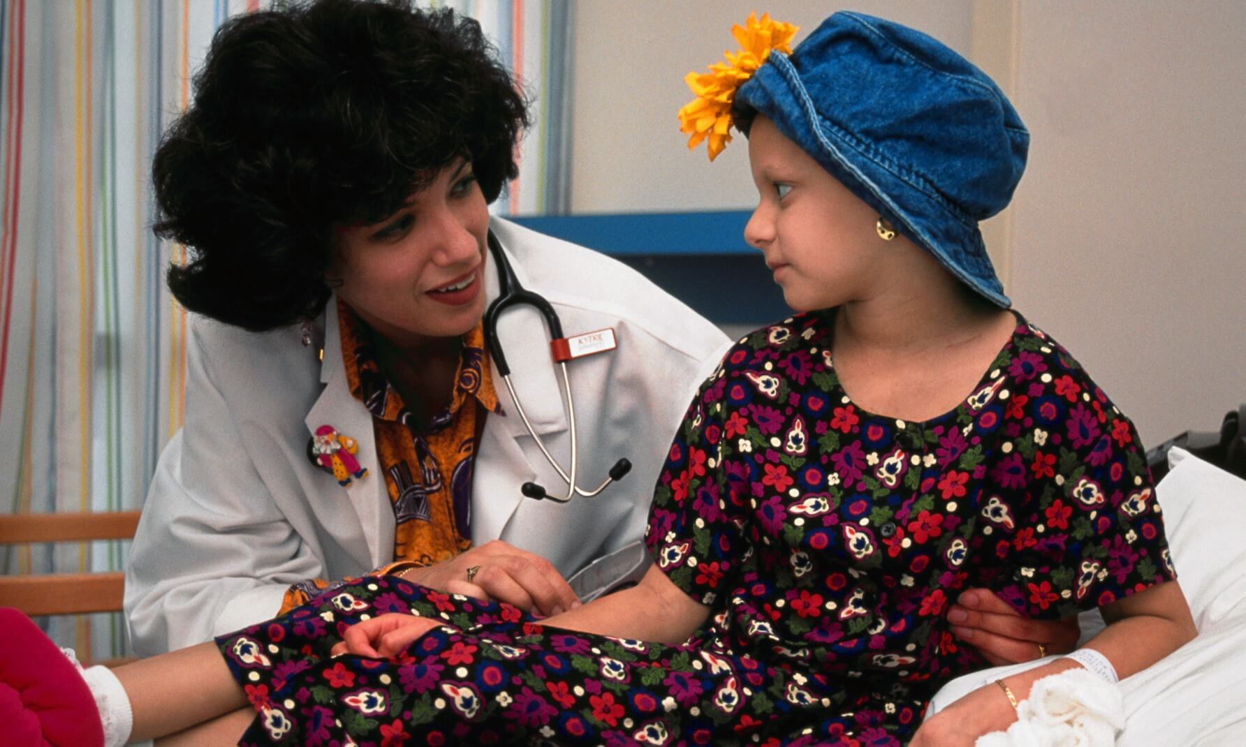 Doctor Comforting Young Cancer Patient